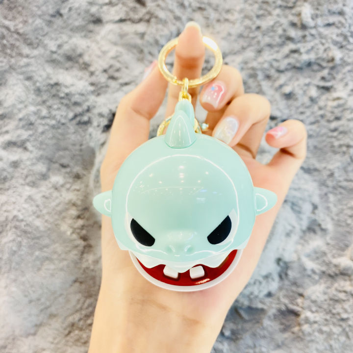 cartoon-shark-bell-keychain-shark-biting-hand-extracting-teeth-prank-backpack-pendant