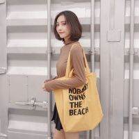 koreafashionshop(KR1783) กระเป๋าผ้าใบใหญ่ NOBODY OWNS THE BEACH ผ้าแคนวาสมี4สาย