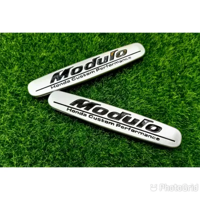 AD. โลโก้ Modulo สีดำเงิน 1คู่ ทำจากพลาสติก สำหรับติดสเกิตท์