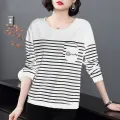 ผู้หญิงเสื้อยืดฤดูใบไม้ร่วง2021ใหม่แขนยาวเสื้อยืดหญิงแฟชั่นเกาหลีขนาดใหญ่ฐานหลวมเสื้อ. 