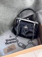 Vivienne Westwood กระเป๋าเกี๊ยวลายจระเข้หนังหลังจากโซ่ดาวเสาร์แปซิฟิกตะวันตกสวมใส่แบบพกพาให้ความรู้สึกที่มีประสิทธิภาพในการฟื้นฟูในรูปแบบโบราณ