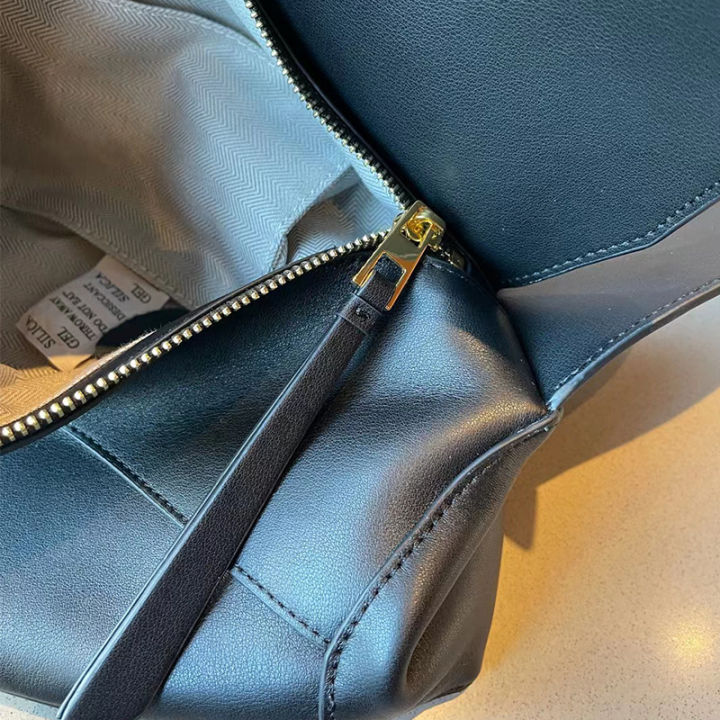 กระเป๋าผู้หญิงหนังแท้ใหม่2023ใบ-กระเป๋าทรงเรขาคณิตแฟชั่นลำลองเข้ากับทุกชุดกระเป๋าแบบหนีบแขนสะพายไหล่ความจุมาก