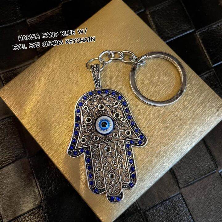 Hand with deals eye charm