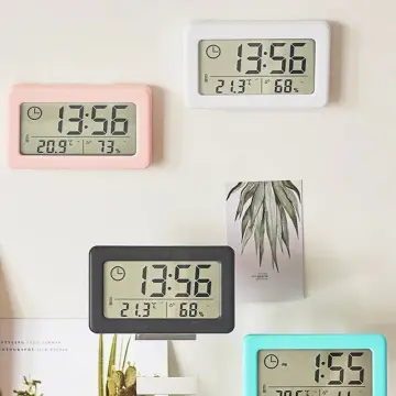 Analogue wall clock with digital thermometer and hygrometer