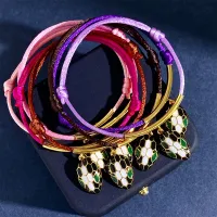 กำไลข้อมือคู่เชือกสีแดง18K ดริปเอนาเมลชุบทองวิญญาณงูดวงตาสีเขียว