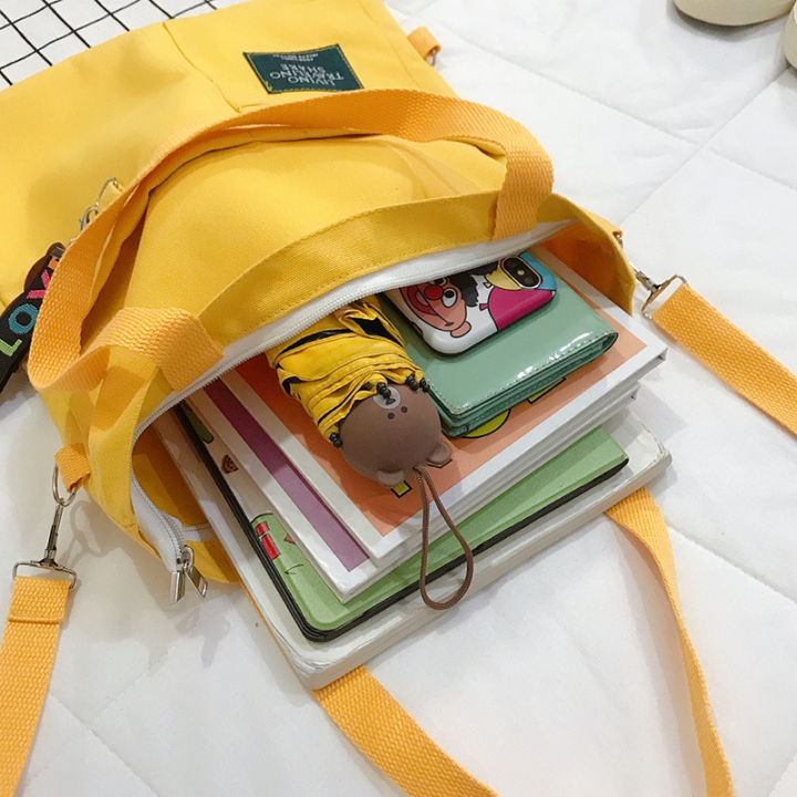 2023-ใหม่สาวผ้ากระเป๋านักเรียนเกาหลีรุ่นกระเป๋าสะพายเอียงไหล่-ins-ผ้าใบกระเป๋าน่ารักสีชน-7bmq