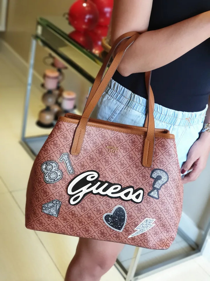 Guaranteed Authentic Guess Women's Classic Tote Bag Vikky 4G Logo in  Signature Coated Leather Quattro G Logo Print with Patches - Brown