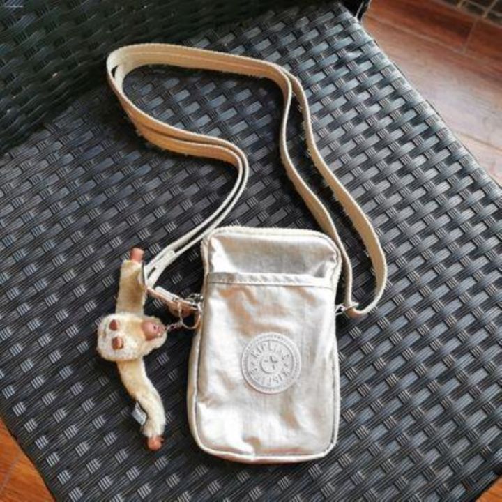 kipling-ทองทรราช-k1079ใหม่กระเป๋าขนาดเล็กผู้หญิงกระเป๋าแมสเซ็นเจอร์นำเทรนด์แฟชั่นใหม่กระเป๋าโทรศัพท์มือถือ