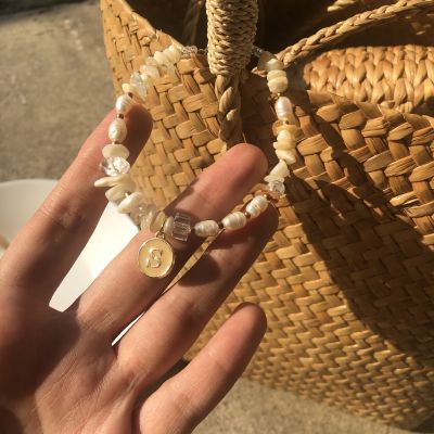 LETSGETAWAY - Bracelet (Preorder 7 days) / สร้อยข้อมือหินธรรมชาติ รุ่น Pearl Stone / สามารถเลือกตัวอักษร N - Z *สีเบจ* ได้ (สินค้าจัดส่งหลังสั่งซื้อ 7 วันทำการ)