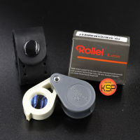 กล้องส่องพระ / ส่องเพชร Rollei-K 10x14mm เทาก้าน-ขาว  เลนส์แก้ว 3ชั้นมัลติโค้ตตัดแสง สไตลเยอรมันชัดใสส่องสบายตา พกพาสะดวก  พร้อมซองหนังแท้