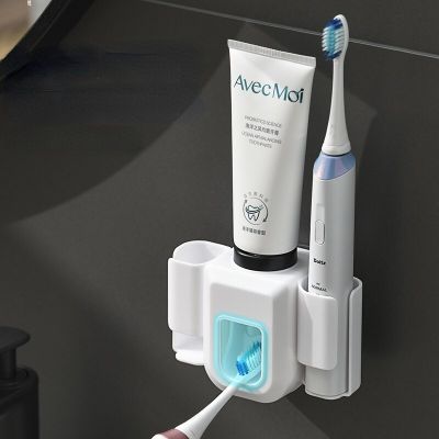 2In ที่คั้นที่เก็บแปรงสีฟันยาสีฟันไฟฟ้าแบบติดผนัง1เครื่องจ่ายยาสีฟันอัตโนมัติอุปกรณ์จัดเก็บในห้องน้ำ