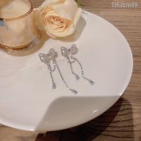 ? เครื่องประดับ 925 silver needle light luxury niche long tassels bowknot earrings female ins tide exquisite zircon super flash stud earrings earrings