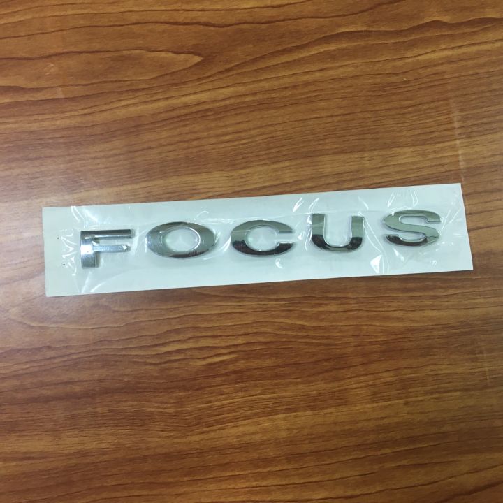 โลโก้* Focus ตัวหนังสือแยก ติดรถ Ford  ขนาด* 1.7 x 16.5 cm สีชุบโครเมี่ยม