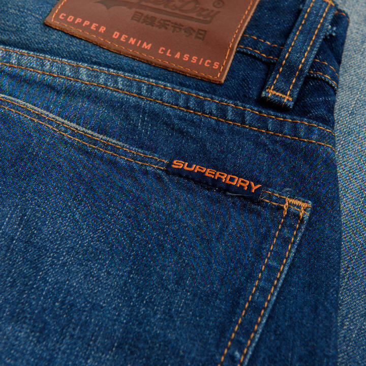 superdry-new-officer-slim-กางเกงยีนส์-สำหรับผู้ชาย-สี-monty-blue-lite