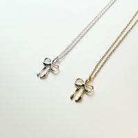 Nue - Ribbon necklace (สร้อยคอเงินแท้ ชุบทอง18k จี้รูปโบว์)