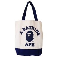 นิตยสารญี่ปุ่นภาคผนวกกระเป๋าพิมพ์ลายหัว BAPE กระเป๋า Tas Jinjing Kanvas ตัดกันสีฟ้าและแผงสีขาวแนวตั้ง