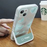 โทรศัพท์ซิลิคอนนุ่มขาตั้งพับได้รูปหัวใจยิ้มที่สวยงามเคสสำหรับ Apple iPhone 14 13 12 11 X XR XS Pro Max Plus เคสแฟชั่นมีสไตล์ฝาหลังจาก GGQcase