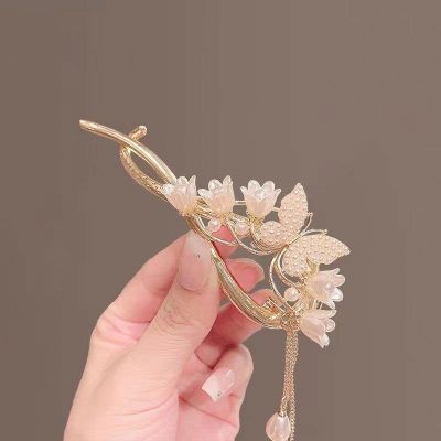 Korean fashion temperament lily of the valley flower tassel pearl twist clip butterfly pearl hairpin exquisite hair accessories