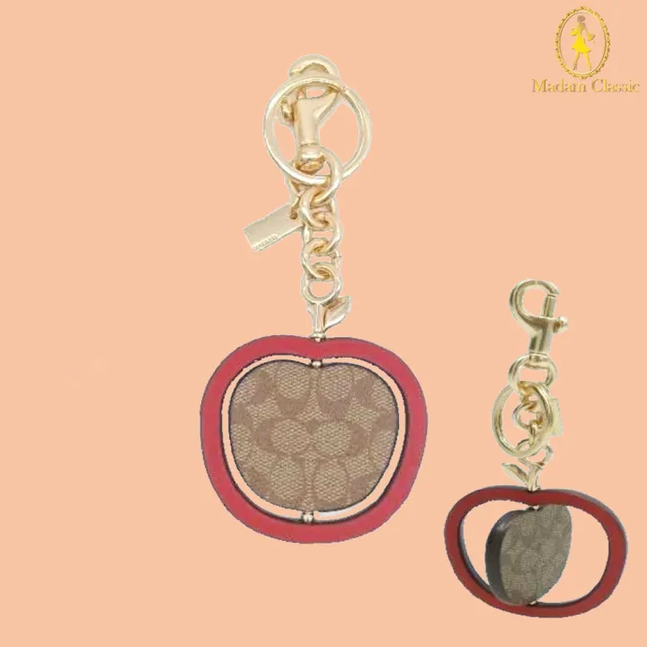 พวงกุญแจ COACH C7097 SPINNING APPLE BAG CHARM IN SIGNATURE CANVAS (IMTJ3) Lazada.co.th