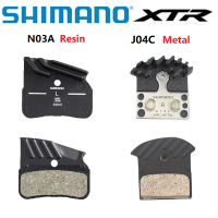 Shimano ครีบ N03A เรซินผ้าเบรก S J04C แผ่นโลหะ DEORE XTR XT SLX ครีบระบายความร้อนเทคโนโลยีน้ำแข็งสำหรับ M8120 M7120 M9120ผ้าเบรกลูกสูบ4ลูกสูบ