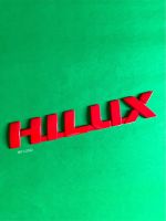 โลโก้ HILUX REVO ขนาด 21.5x3.5cm. ติดTOYOTA สีแดง