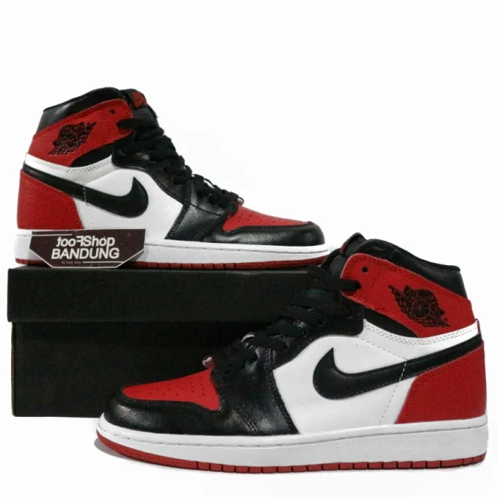 black white and red high top jordans