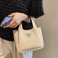 Niche basket bucket bag 2023 new pradaˉhandbag mini tote bag carrying commuter slung bag leather