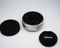 Nikon 1 Nikkor 10mm f/2.8 Prime Wide Angle Silver Lens, 77 g (2.8 oz), RF Aspherical Nikon’s Stepping Motor (super-quiet AF) 27mm in 35mm format, 10mm f2.8 10mm F2.8 Wide-Angle