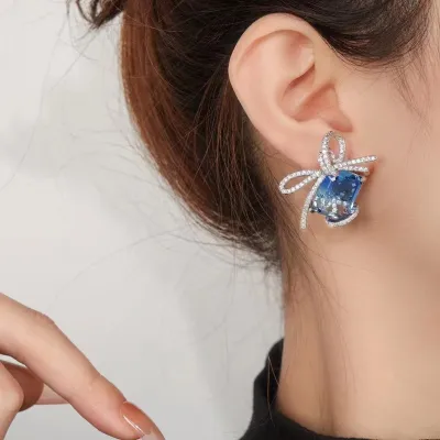 [COD] New product light luxury style high-end blue diamond inlaid zircon earrings female bow Korean version of silver needle net red accessories