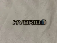 โลโก้ LOGO HYBRID งานเคลือบแก้ว ติดรถยนต์ TOYOTA HYBRID ขนาดยาว15.3cm. กว้าง2.2cm.*สิ้นค้าดี ราคาดีที่สุด*