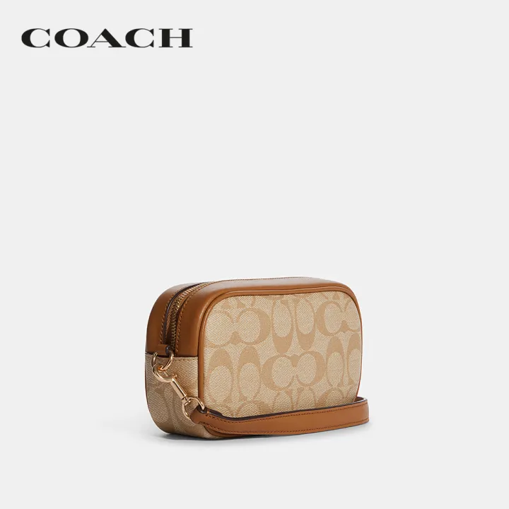 coach-กระเป๋าคล้องมือผู้หญิงรุ่น-jamie-wristlet-in-signature-canvas-สีครีม-ca718-imnlj
