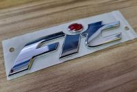 โลโก้ ฟิท ฮอนด้า แจ็สฟ้อนเก่า จุดแดง ขนาด 12.5 * 3 cm ปี 2003 - 2006 FIT GD Honda car logo emblem for rear trunk