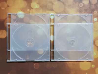 กล่องเปล่าใส่แผ่น CD / DVD SLIM ขาวใส ขนาดมาตรฐาน (หนา 5.0 mm.) แพ็คละ 4 แผ่น
