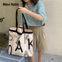 Movi Katie ชุดลำลองพิมพ์ตัวอักษรสะพายไหล่สำหรับผู้หญิงกระเป๋าผ้าใบความจุขนาดใหญ่กระเป๋าโท้ทกระเป๋านักเรียนเด็กผู้หญิงถุงช้อปปิ้ง