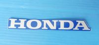 สติ๊กเกอร์เครื่องหมายHONDA ติดฝาครอบบังลมแท้HONDA Dream 110i สีเทาพื้นน้ำเงิน อะไหล่แท้ศูนย์HONDA(86102-KZV-T00ZB)1ชิ้น