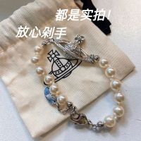 Vivienne Westwood สร้อยคอสร้อยข้อมือดาวเสาร์สามมิติที่เต็มไปด้วยเพชรเพทายสร้อยคอแบบย้อนยุคสุดหรูแสงสไตล์สีแดงสุทธิ