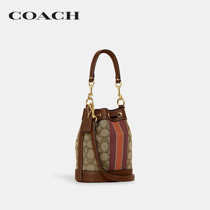 coach-กระเป๋าสะพายข้างผู้หญิงรุ่น-mini-dempsey-bucket-bag-in-signature-jacquard-with-stripe-and-coach-patch-สีน้ำตาล-c8322-imvgb