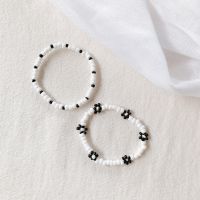 (พร้อมส่ง) Bijou daisy &amp; basic beads เซตข้อมือไหมยืดสองเส้น