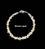 ลูกปัดโอปอลไม่เจียระไนสีน้ำตาล 19 ซม. . brown   uncut opal uneven beads 19 cms .