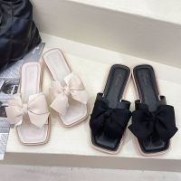 รองเท้าแตะสำหรับสุภาพสตรี Bowknot slippers female temperament hot style 2023 joker flat new summer beach drag a word