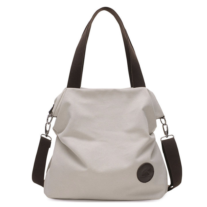 2023-ใหม่เมืองที่เรียบง่ายศิลปะกระเป๋าหญิงกระเป๋าสะพายไหล่เดียวนักเรียนกระเป๋าผ้าใบกระเป๋าใหญ่ขายส่ง