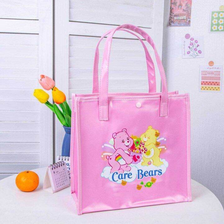 carebear-กระเป๋าใบเล็ก-มีทั้งหมด-4-สี-ลาย-full-print-งาน-pvc-พลาสติกหนา-กันน้ำ-มีกระดุมติดปากกระเป๋า-ขนาด-27-27-10-cm