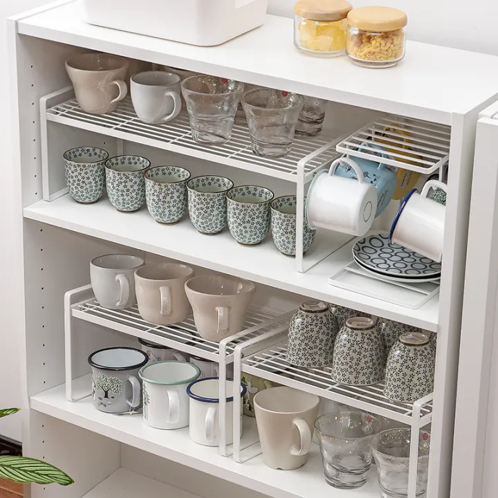 Cup storage rackcontrolled layered shelf, water draining of