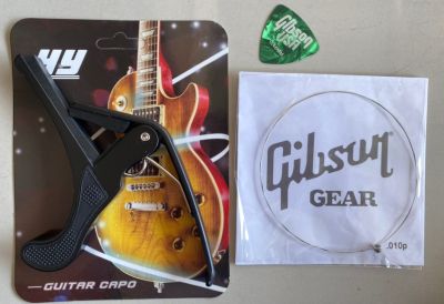 คาโป้ CAPO อย่างดี สีดำ มาพร้อมกับ สายแยกGibsonกีต้าร์โปร่ง เบอร์ 010 1เส้น + ปิก1ชิ้น