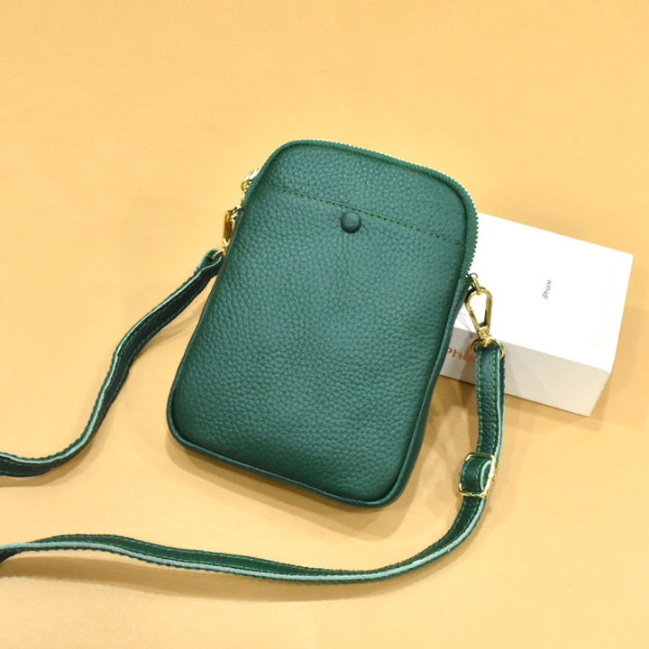 กระเป๋าขนาดเล็กแบบเรียบง่ายผู้หญิงรุ่นมินิกระเปาสะพายข้างหนังวัวโทรศัพท์มือถือกระเป๋าทรงอานม้าไขว้