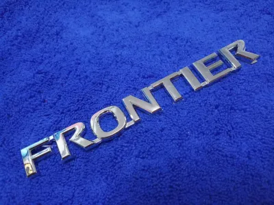 AD.โลโก้ ตัวหนังสือ FRONTIER สีชุบ ขนาด 17×2 cm