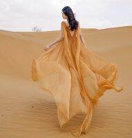 ?เดรสวันพักผ่อนโชว์หลังชุดเดรสท่องเที่ยวสวยๆผ้าชีฟองหางยาวคอวีทะเลทรายชิงไห่ซินเจียง