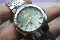 นาฬิกา Vintage มือสองญี่ปุ่น SEIKO ELNIX 0703 8040 ระบบ QUARTZ ผู้ชาย ทรงกลม กรอบเงิน หน้าปัดสีเขียว หน้าปัด 37มม. ตัวเรือนสแตนเลสใช้งานได้ปกติ สภาพดี ของแท้ ไม่กันน้ำ