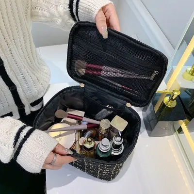 High-end MUJI small fragrance cosmetic bag fashion high-end 2023 large-capacity portable retro hand-held womens light luxury makeup