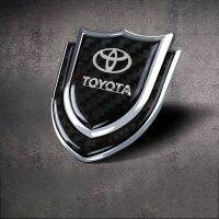 Hot New 1 Piece Carbon Fiber Shield Car Sticker Auto Side Badge For Toyota Vios Wish Reiz Revo Sienta Harrier Chr Hilux Camry Axio Yaris Car  Decoration Decal Car Emblem Accessories qing zhi